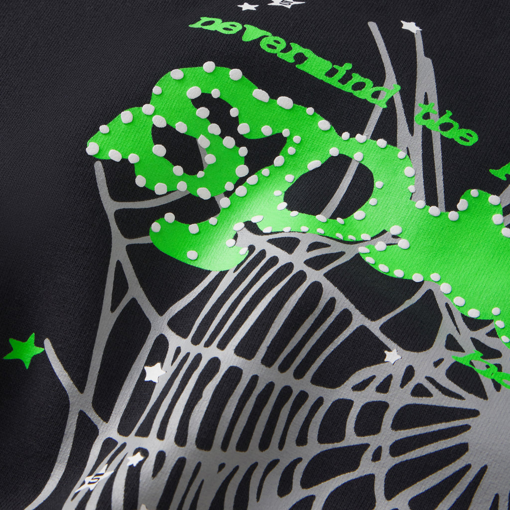 Black 13oz cotton fleece hoodie featuring a green puff print SP5DER motif and grey web graphic design.