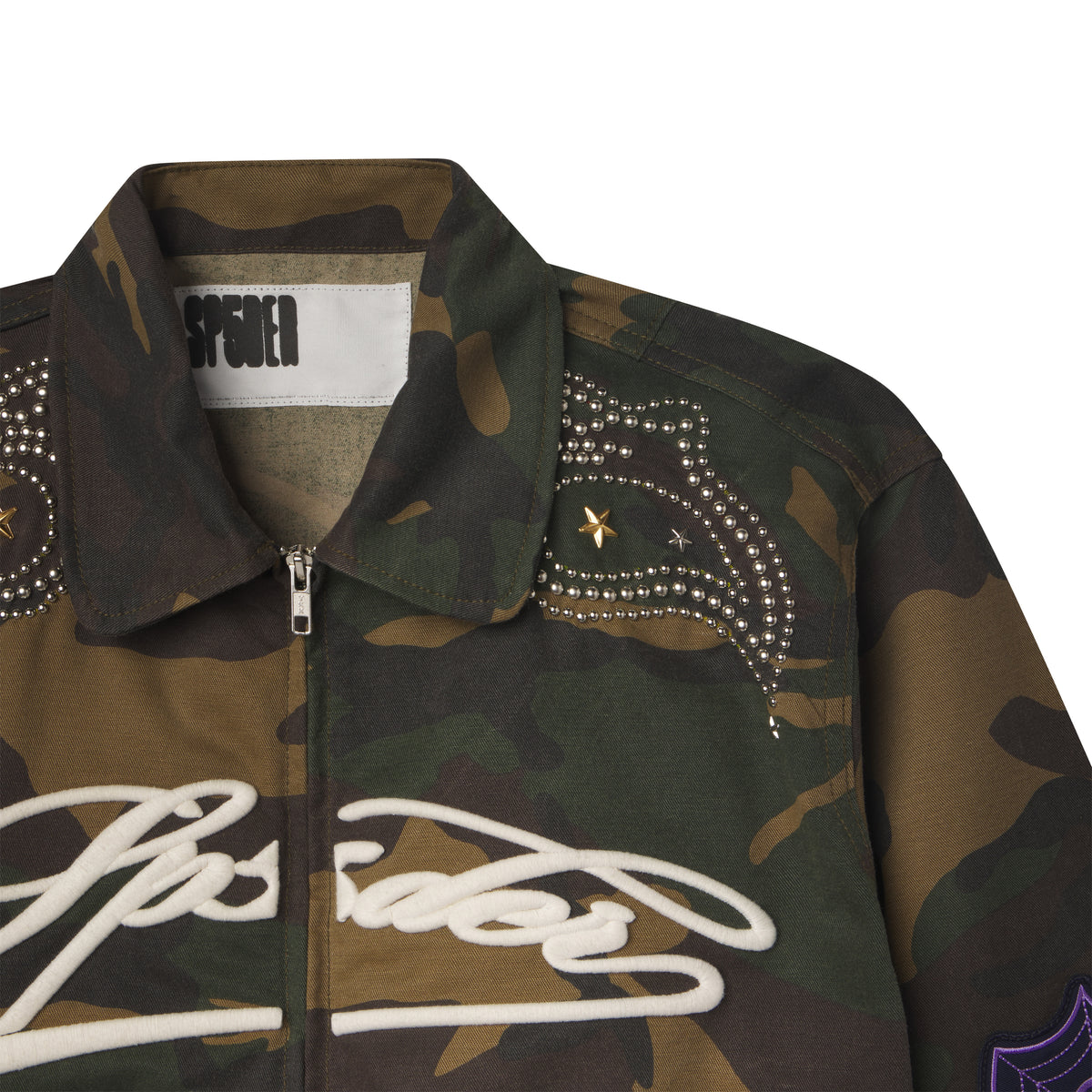 Camo cotton canvas bomber jacket with embroidered white script, studded shoulder detailing, and a spread collar.