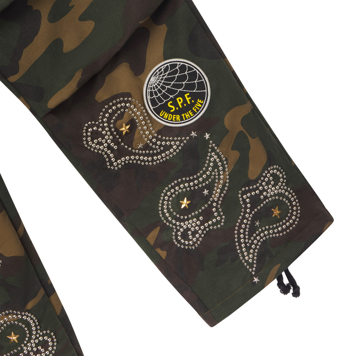 Camo cotton canvas cargo pants featuring embroidered graphic patches, studded paisley designs, and star accents.