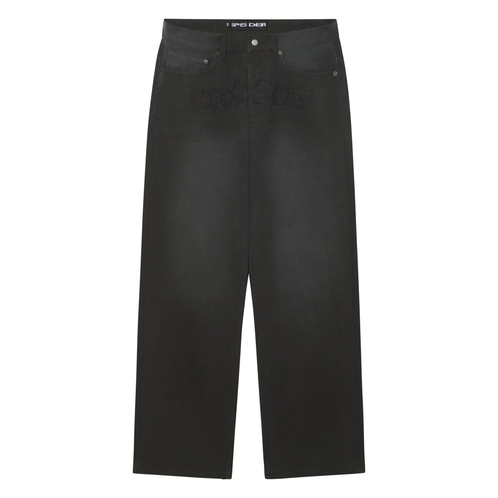 Faded black 13oz denim pants with a frayed SP5DER graphic logo across the crotch and custom branded hardware.