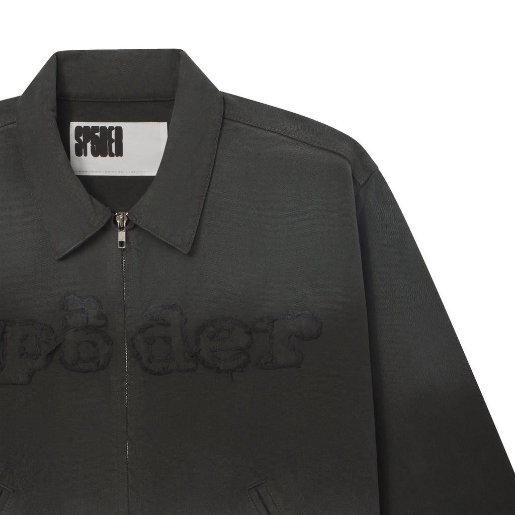 Distressed black 13oz canvas zip-up work jacket with frayed SP5DER graphic embroidery and a boxy silhouette.