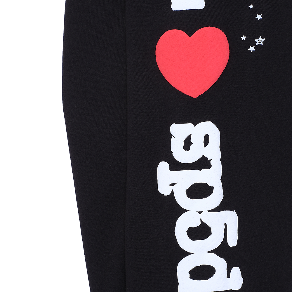 Black souvenir sweatpant with white "I love sp5der" puff print, red heart, and white star details.