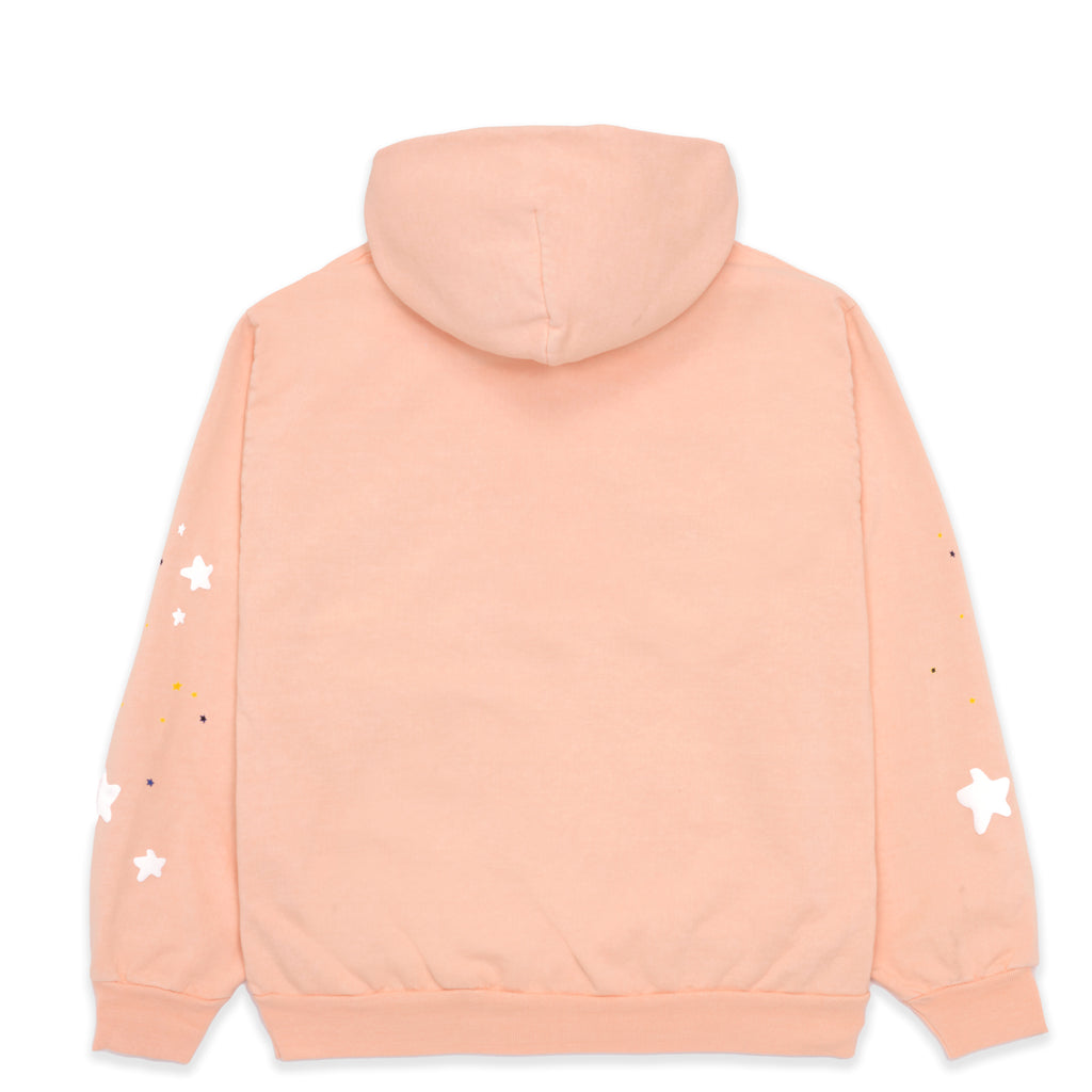 Back of a peach SP5 BELLINI HOODIE with white puff print stars and small colorful dots on the sleeves.