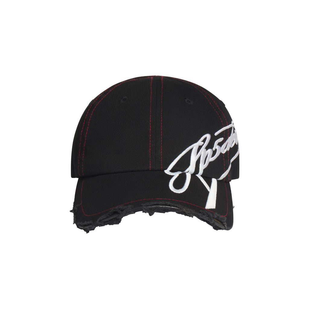 Black baseball hat with red stitching, distressed brim, and white cursive graphic embroidery extending to the side.