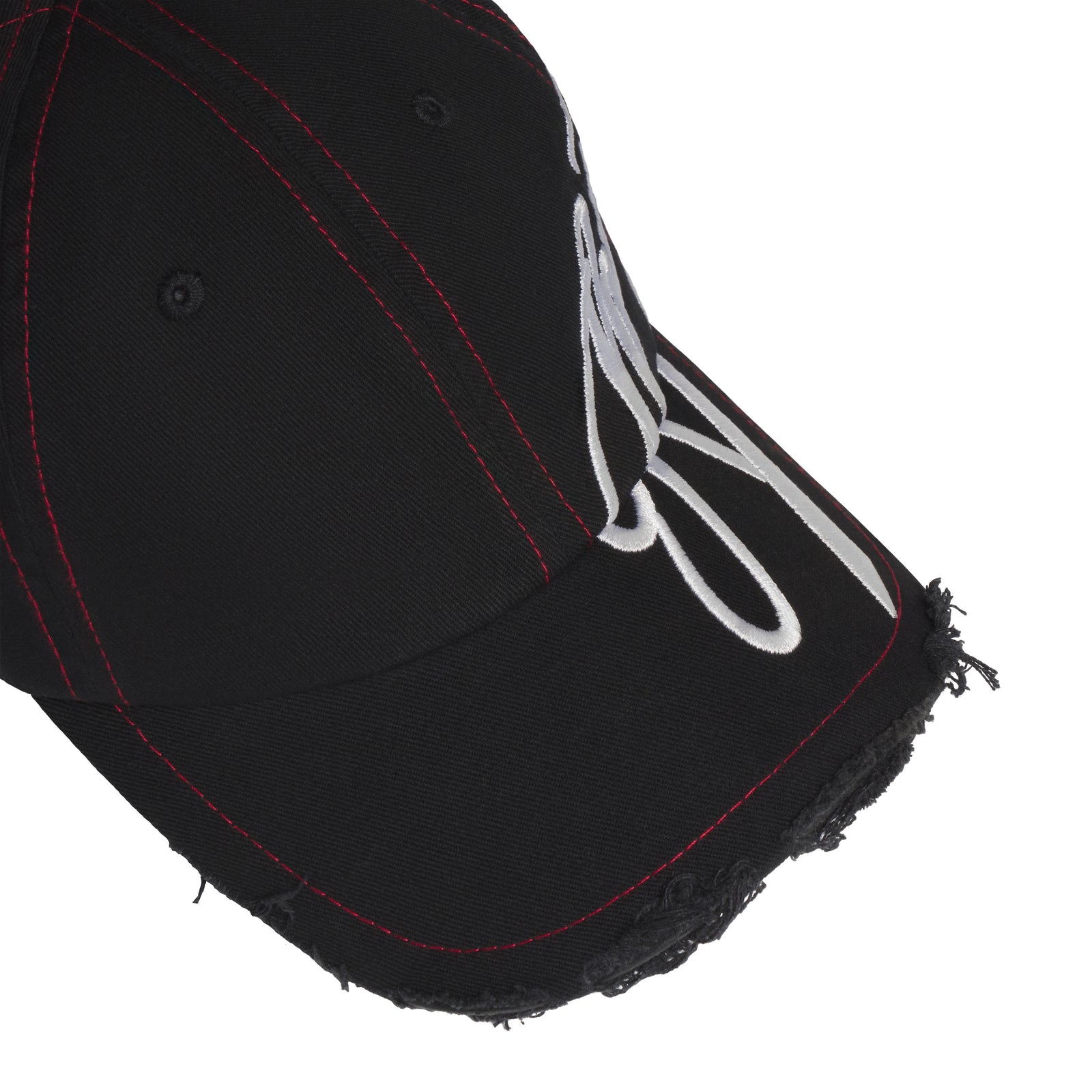 Black baseball hat with red stitching, distressed brim edges, and white cursive graphic embroidery extending to the side.