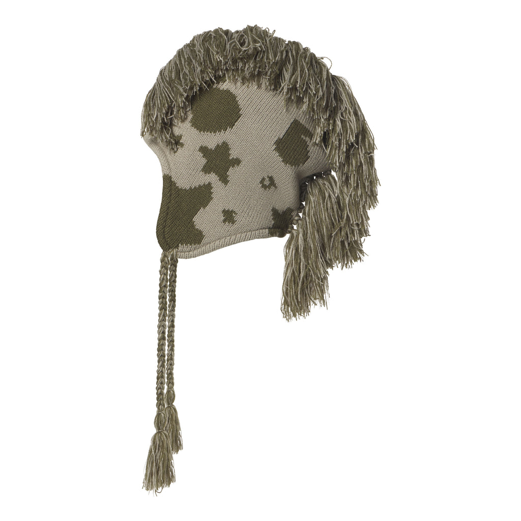 Beige and olive knit hat with a beluga graphic print, mohawk fringe crown, ear flaps, and braided tie cord tassels.