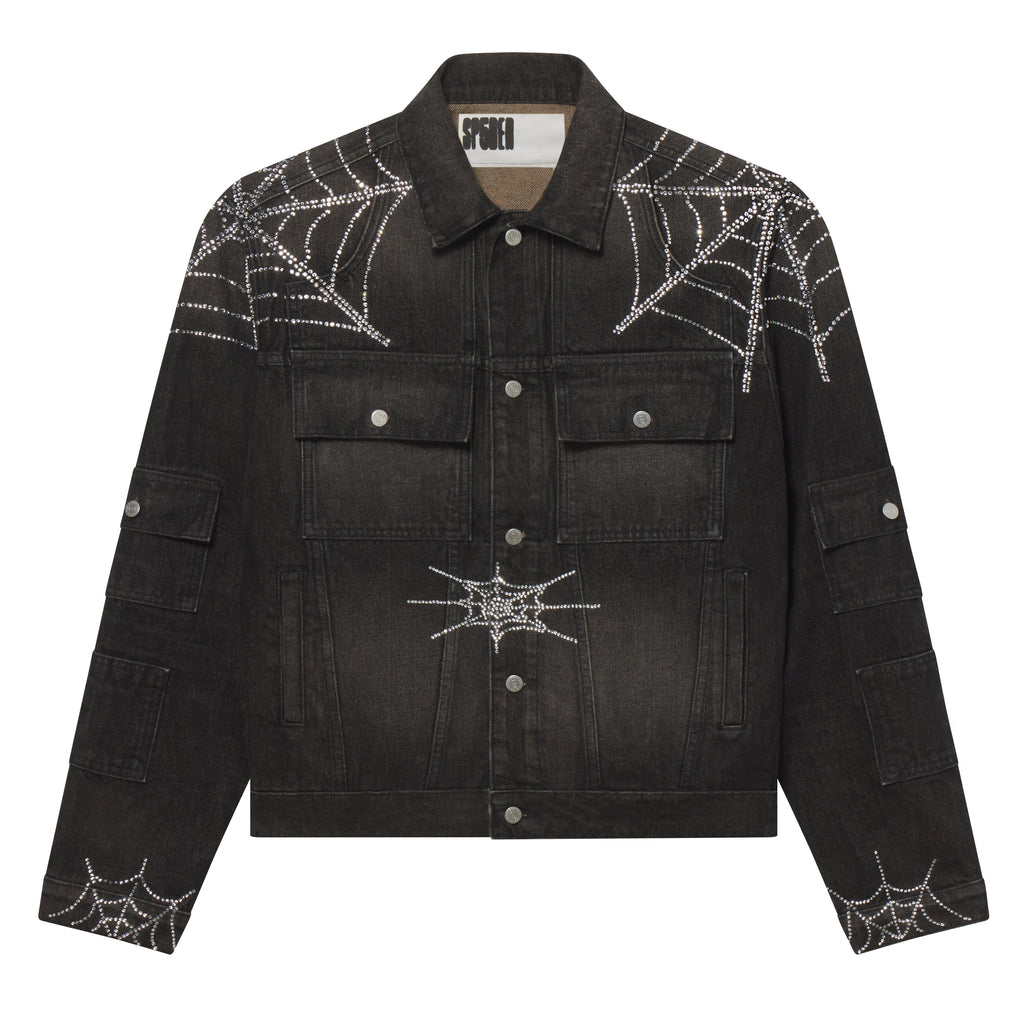 Black denim jacket featuring silver rhinestone spider web graphic prints, chest flap pockets, and silver button closures.