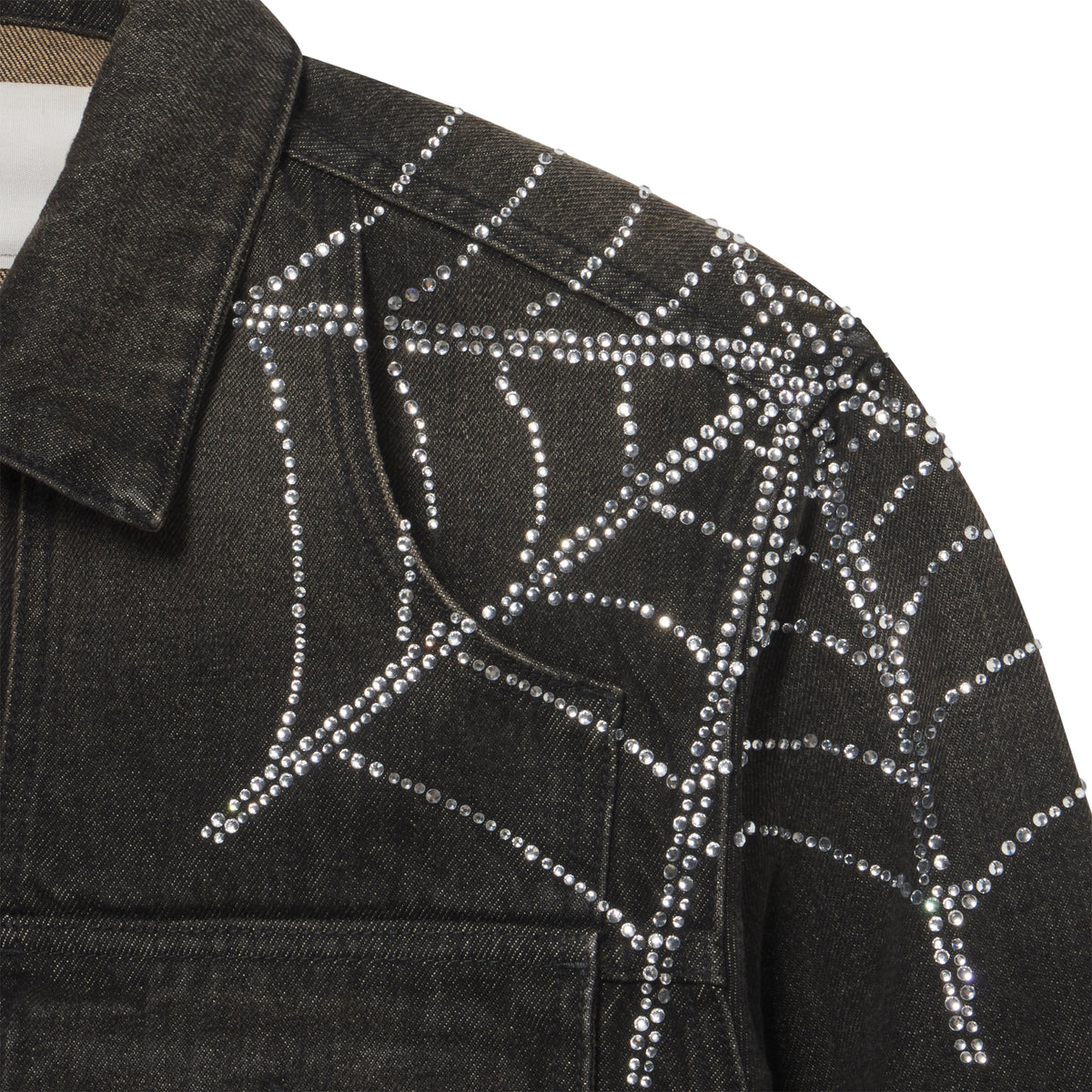 Black denim jacket featuring a sparkling rhinestone web graphic print across the shoulder and chest.