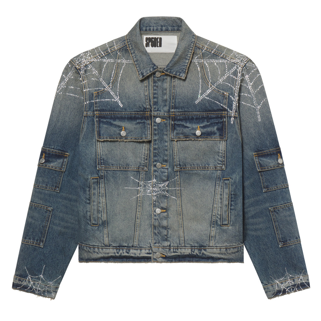 Blue denim jacket featuring a rhinestone web graphic print, chest and arm flap pockets, and silver button closures.