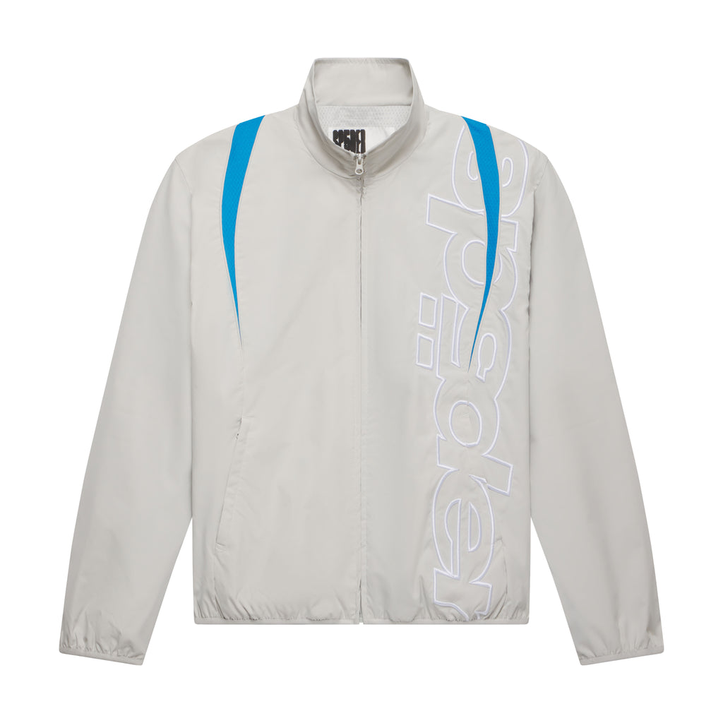 Beige nylon track jacket with blue contrast panels, stand collar, and white embroidered graphic text on the front.