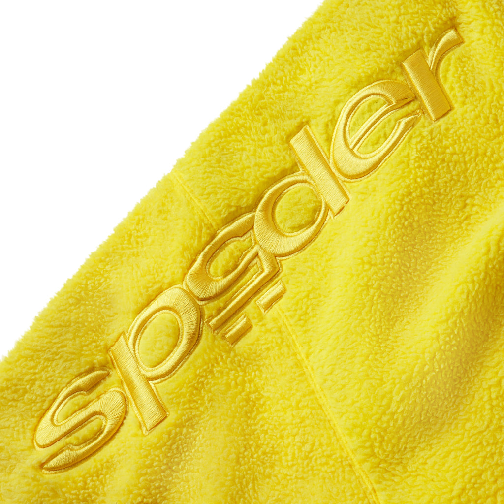 Bright yellow textured fleece jacket sleeve with tonal embroidered SP5DER graphic design.