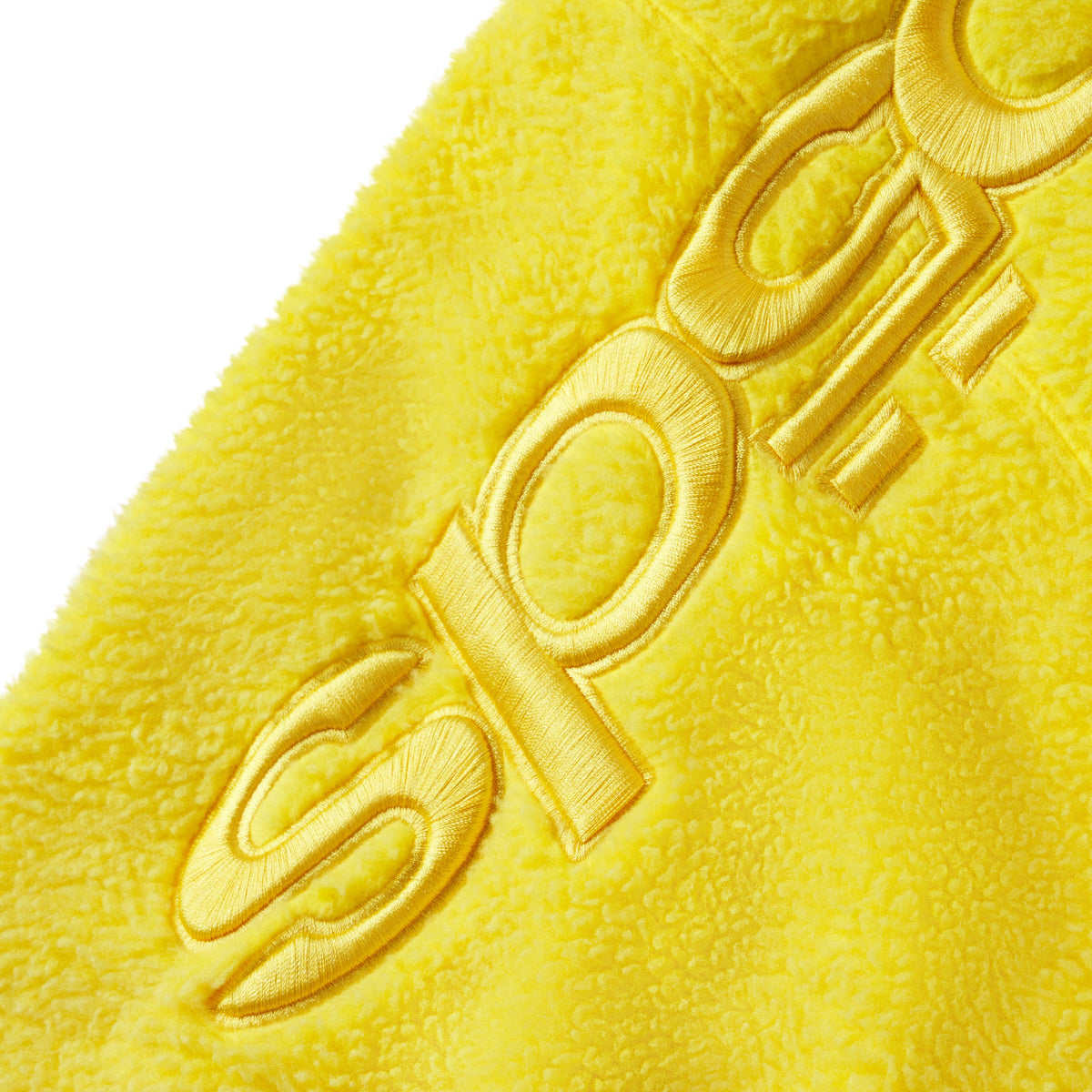 Bright yellow textured fleece jacket featuring tonal embroidered SP5DER graphic design on the sleeve.