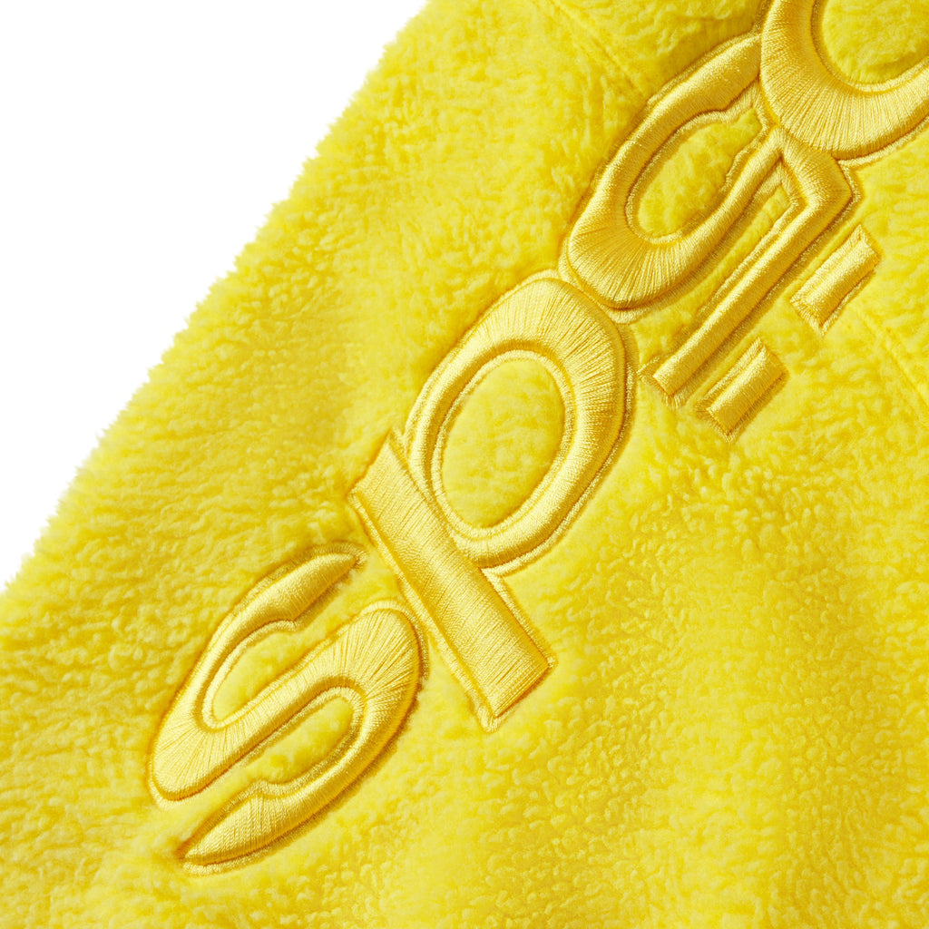 Bright yellow textured fleece jacket featuring tonal embroidered SP5DER graphic design on the sleeve.