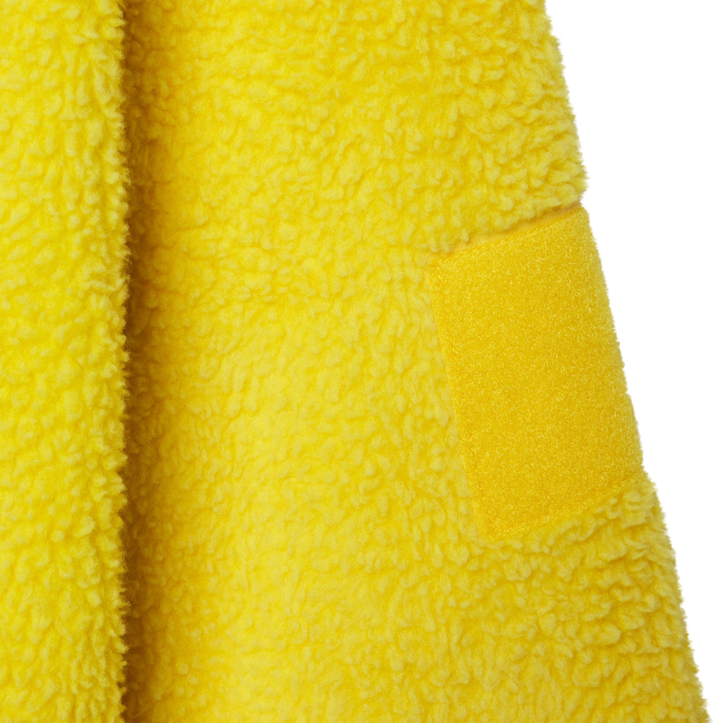 Bright yellow textured fleece jacket with a smooth fabric sleeve patch detail.