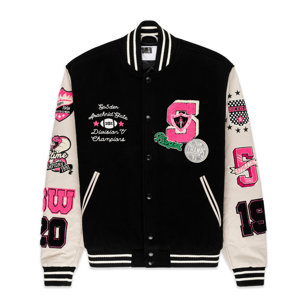 Black wool varsity jacket with cream leather sleeves, pink and black patches, and striped ribbed trim.