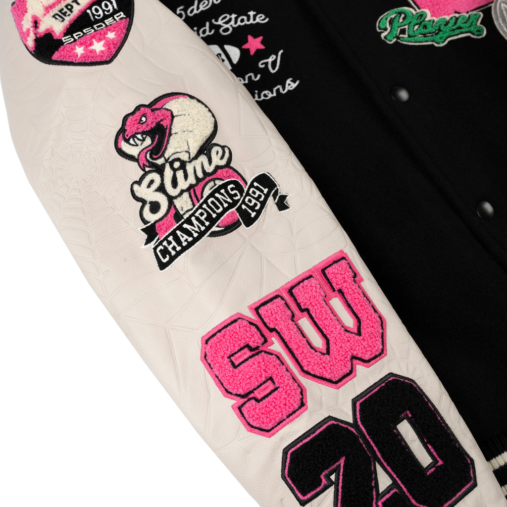 DIVISION 5 Varsity Jacket: Black wool body, white leather sleeve with debossed web, pink embroidered patches.