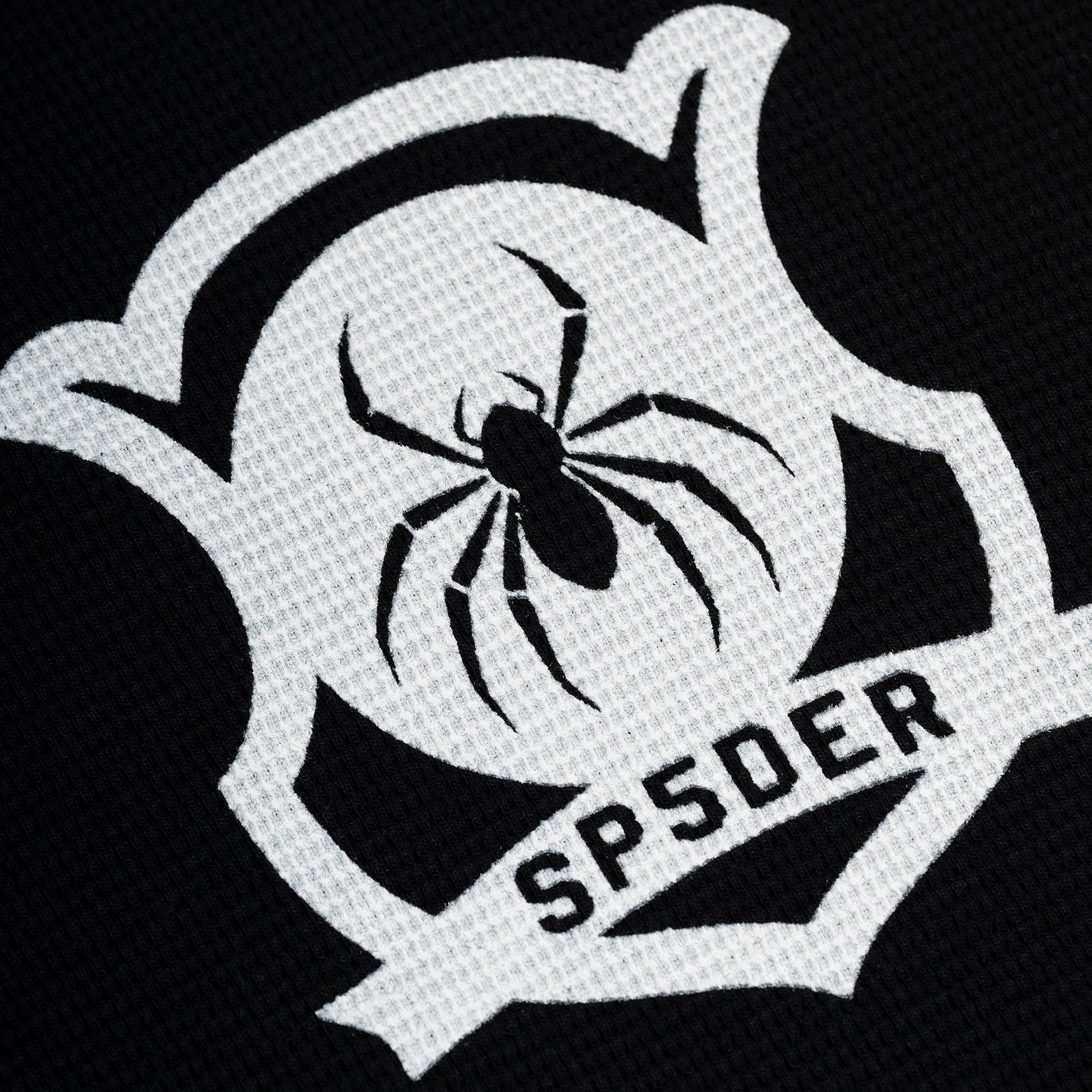 Black waffle knit thermal with white shield graphic featuring a black spider and "SPSDER" text.