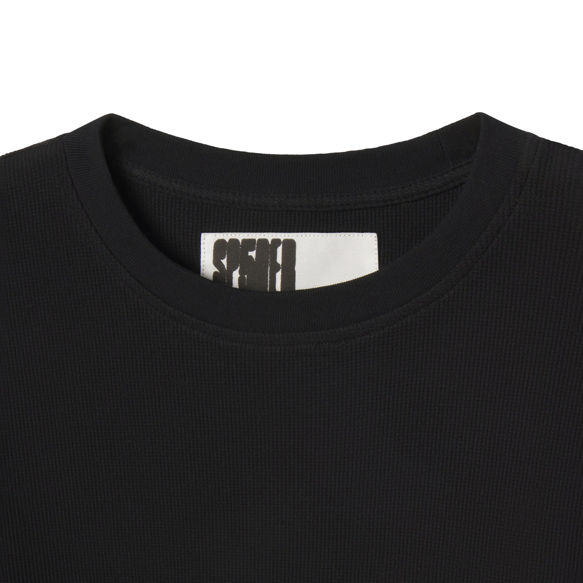 Black waffle knit thermal shirt featuring a ribbed crew neck collar and a branded interior neck label.