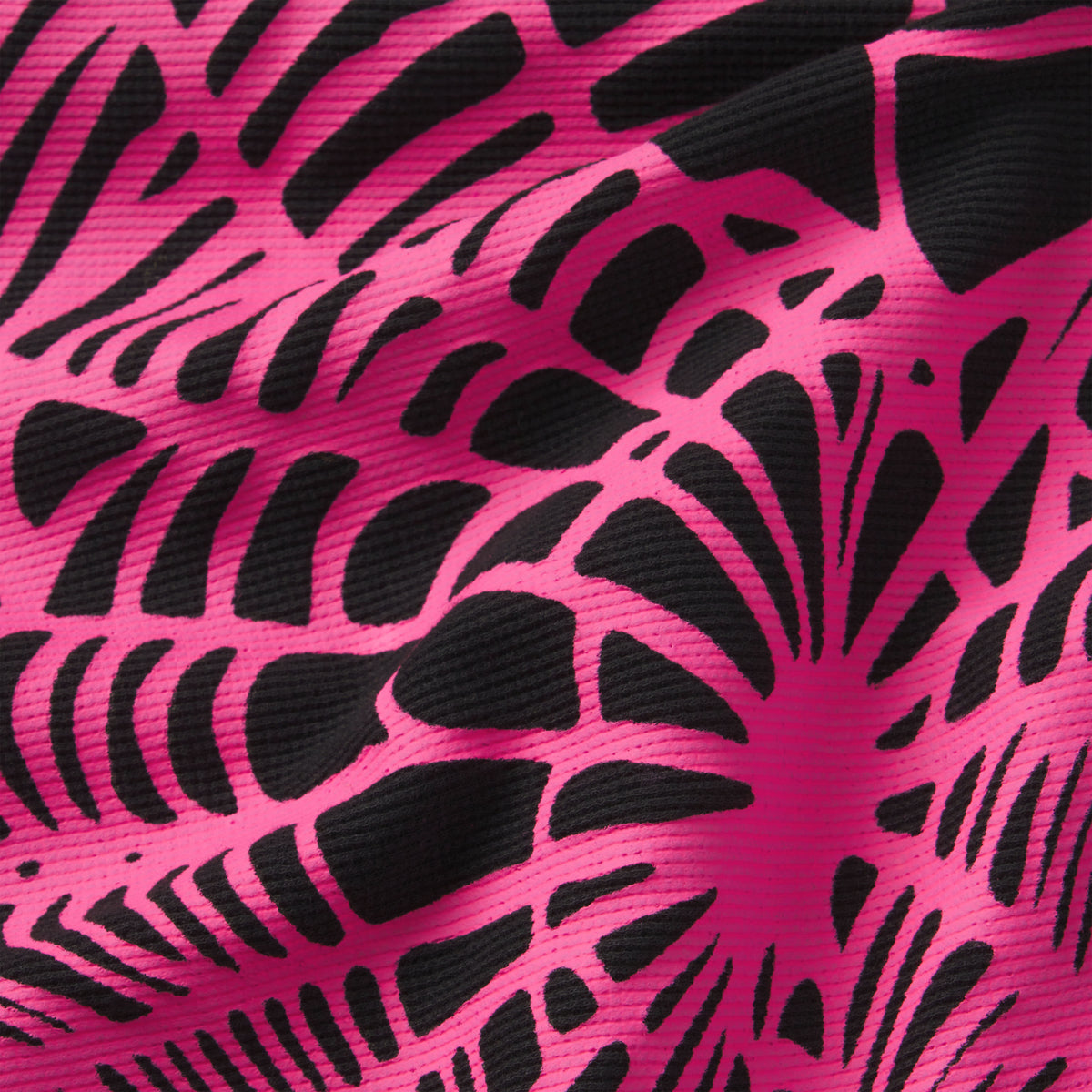 Waffle knit thermal fabric featuring a bold black and hot pink abstract graphic print with a textured ribbed finish.