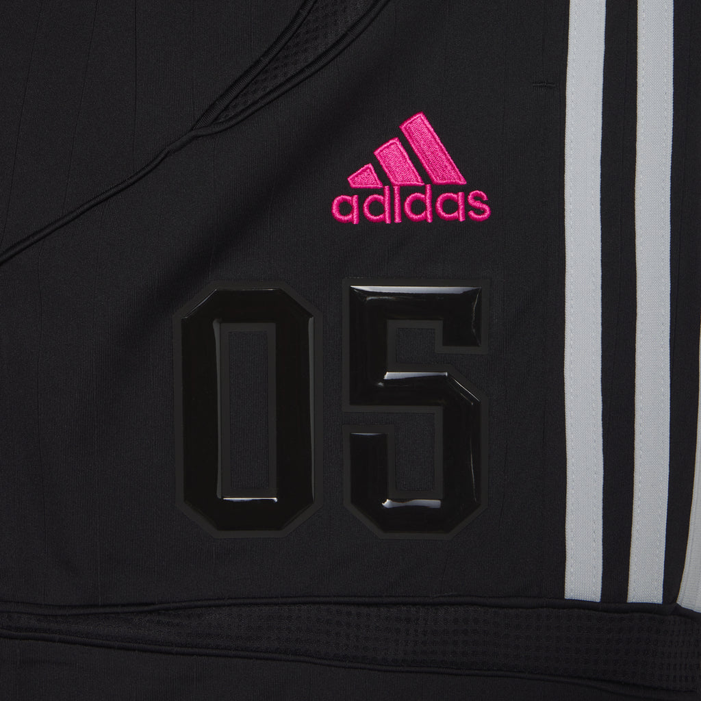 Black SP5DER FOOTBALL SHORT with pink adidas logo, raised "05" appliqué, and white 3-Stripes.