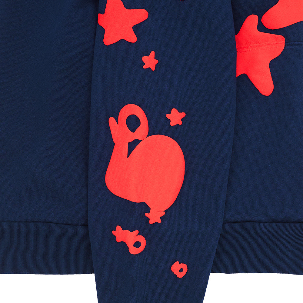 Navy BELUGA HOODIE sleeve with red puff print stars and 'SP5DER' graphic.