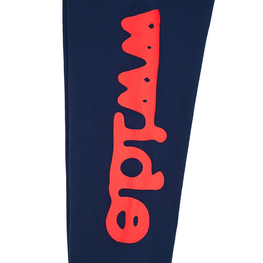 Navy BELUGA SWEATPANT with vertical red "Worldwide" puff and discharge print down the leg.