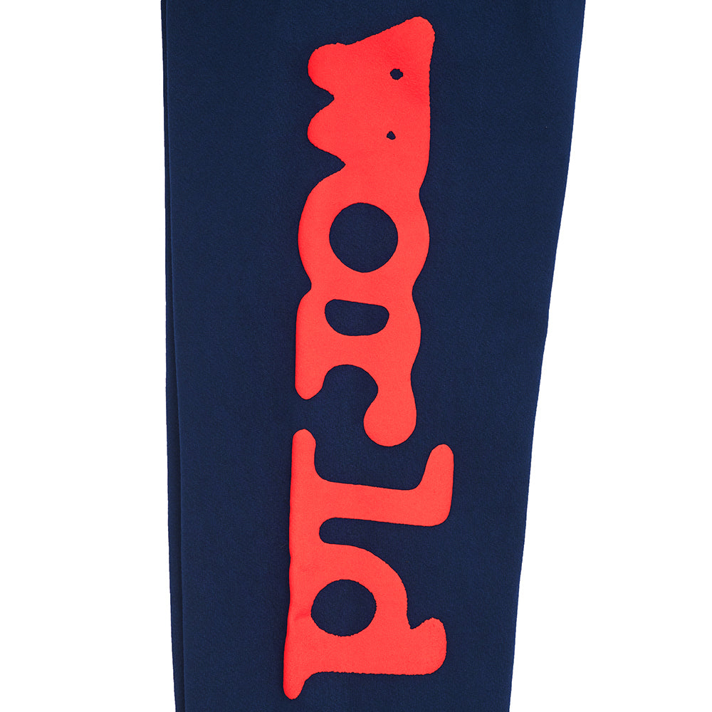 Navy BELUGA SWEATPANT with red puff print "Worldwide" text down the leg.
