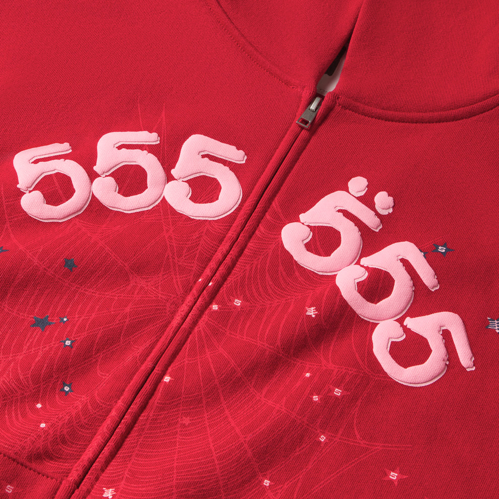 Red 100% cotton fleece zip hoodie with pink puff print "555" angel numbers and subtle star/spiderweb pattern.