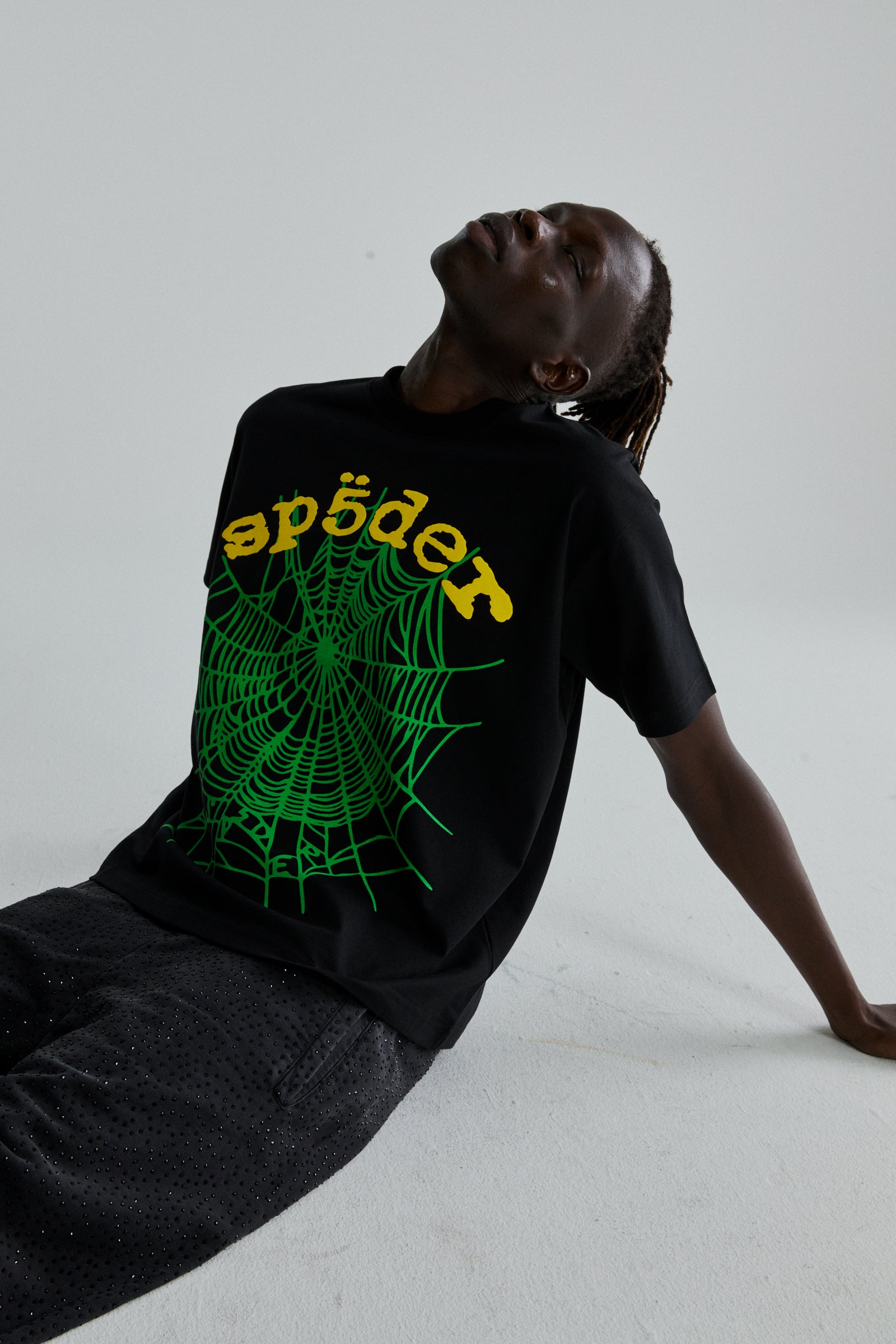 Black cotton OG WEB V2 TEE with green spider web and yellow "sp5der" puff print.