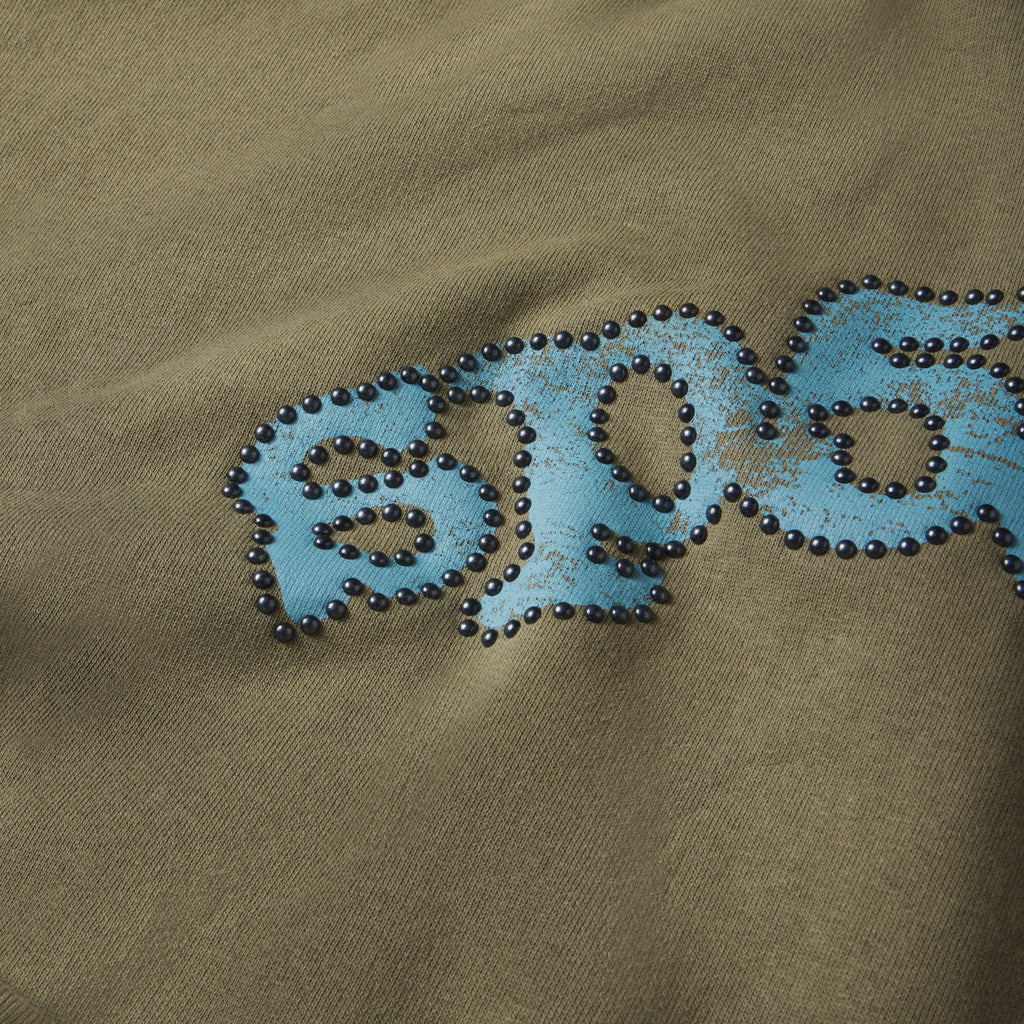 Olive green cotton fleece hoodie featuring a distressed blue graphic logo outlined with metallic studs.