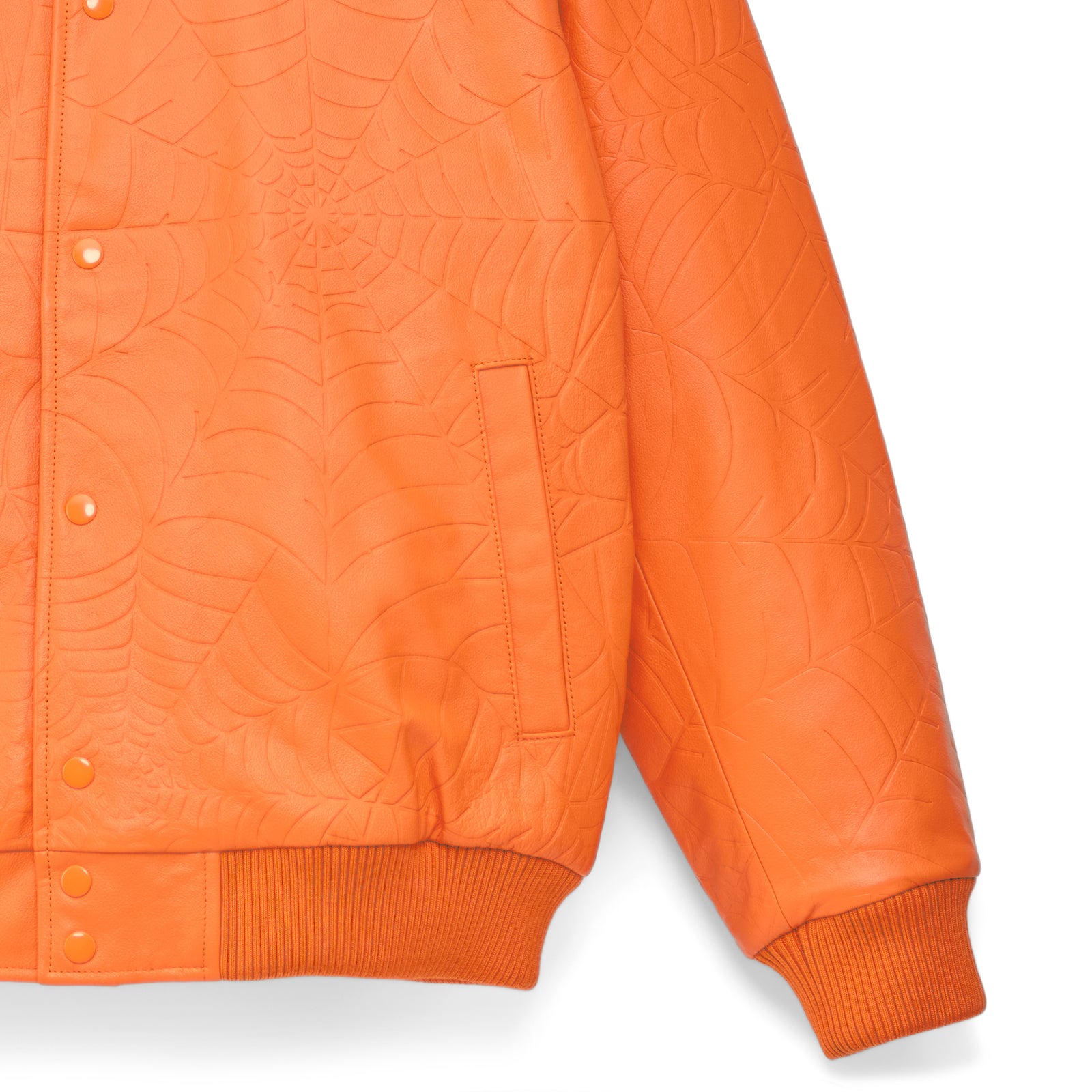 Orange cowskin leather jacket with debossed web design, press-stud closure, and ribbed cuffs.