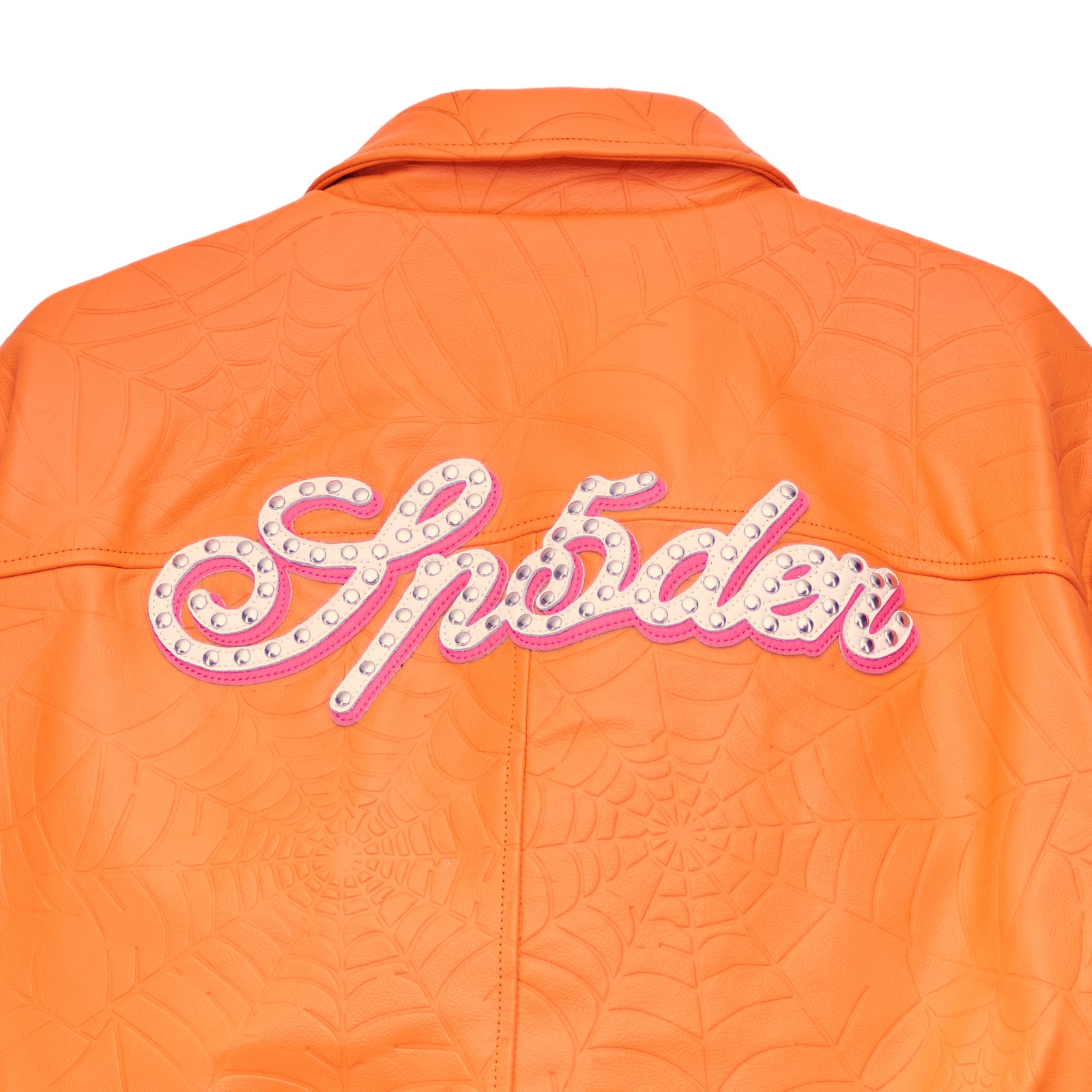 Orange cowskin leather jacket with debossed web design and studded "Spider" text on the back.