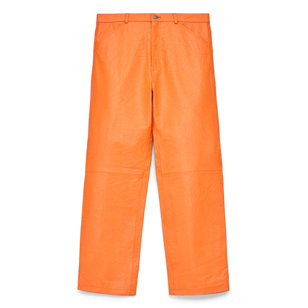Orange cowskin leather pants with debossed web design, button fly, and belt loops.
