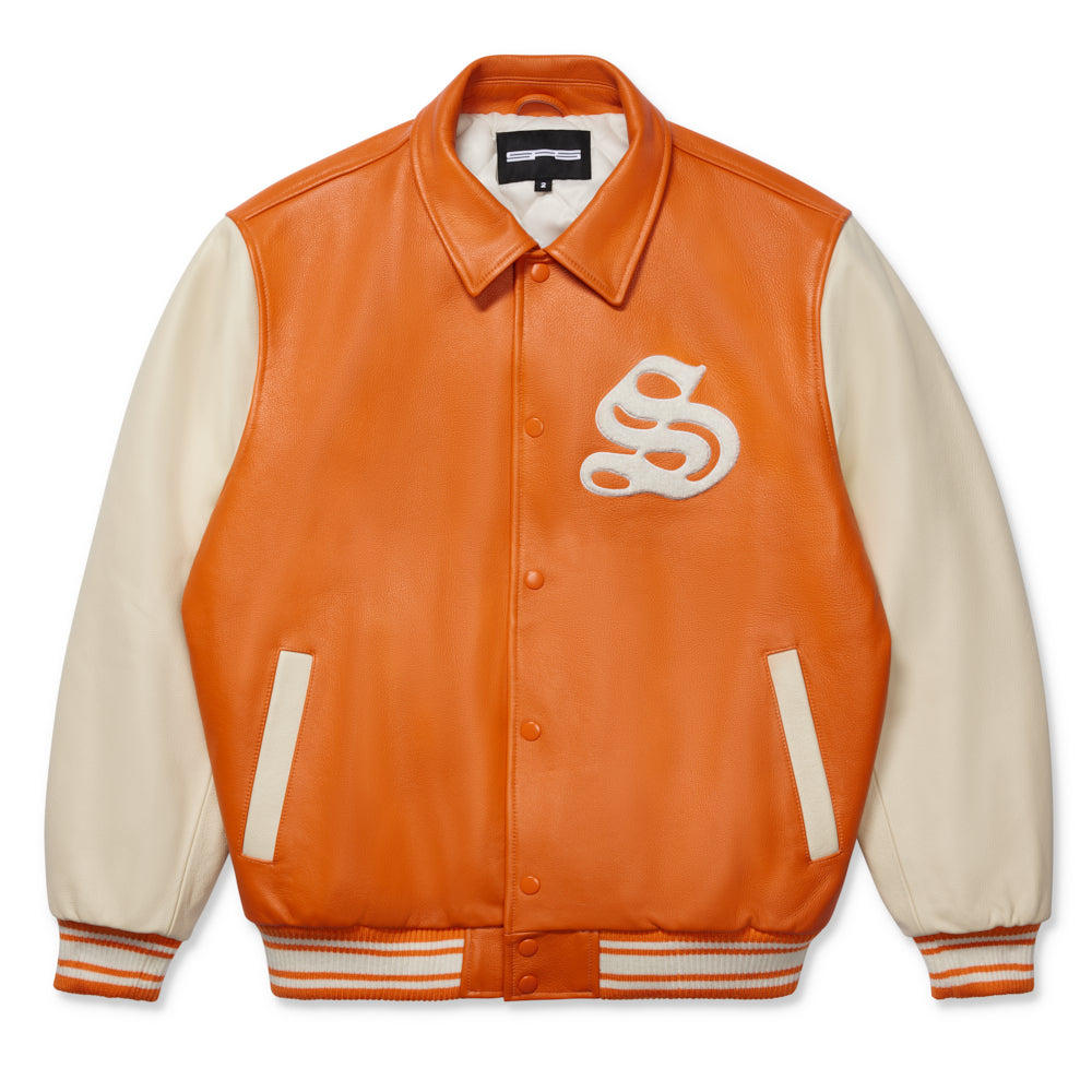 Orange leather varsity jacket with cream sleeves, chenille 'S' patch, and striped ribbed trim.