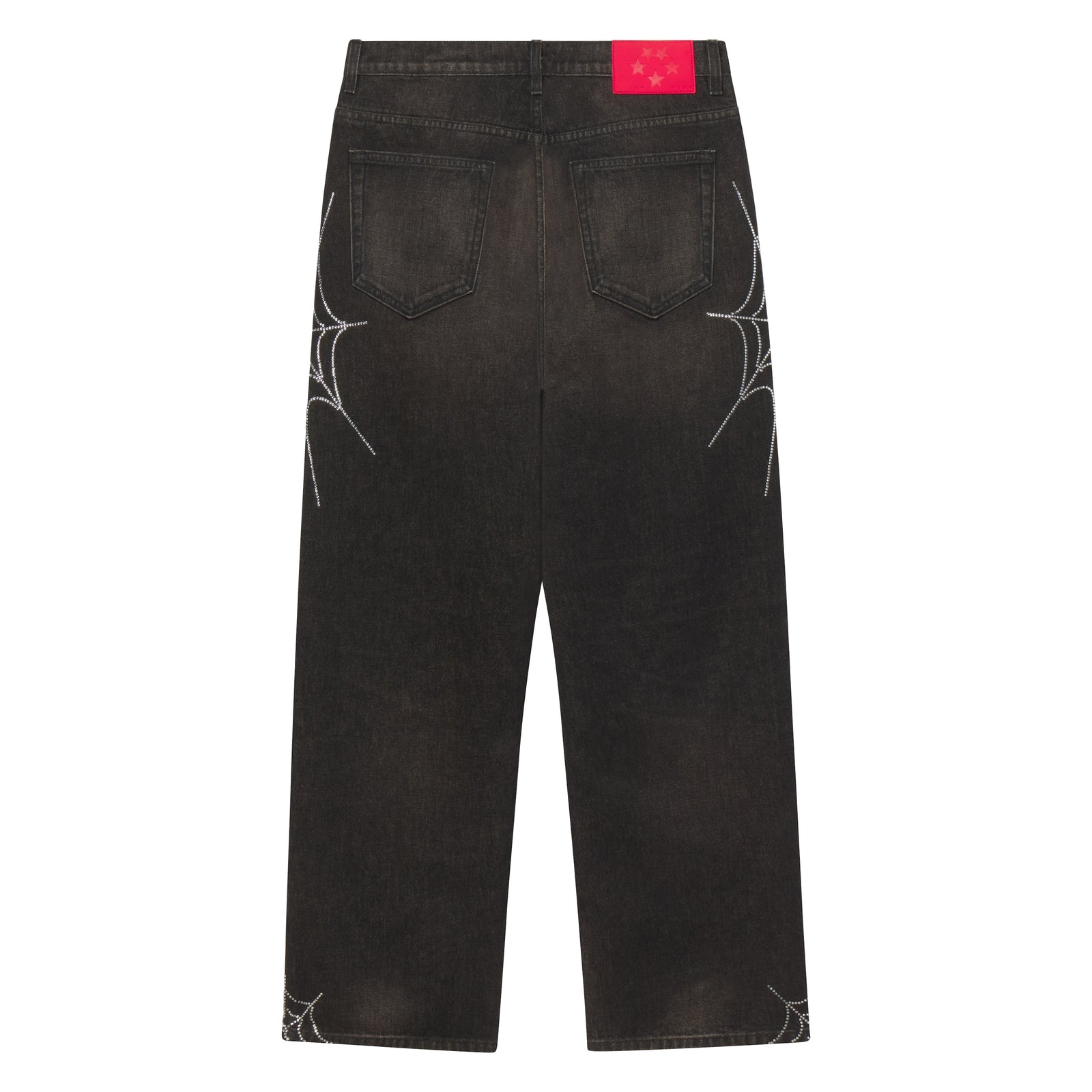 Faded black straight-leg denim jeans featuring rhinestone web graphic designs and a red branded leather back patch.