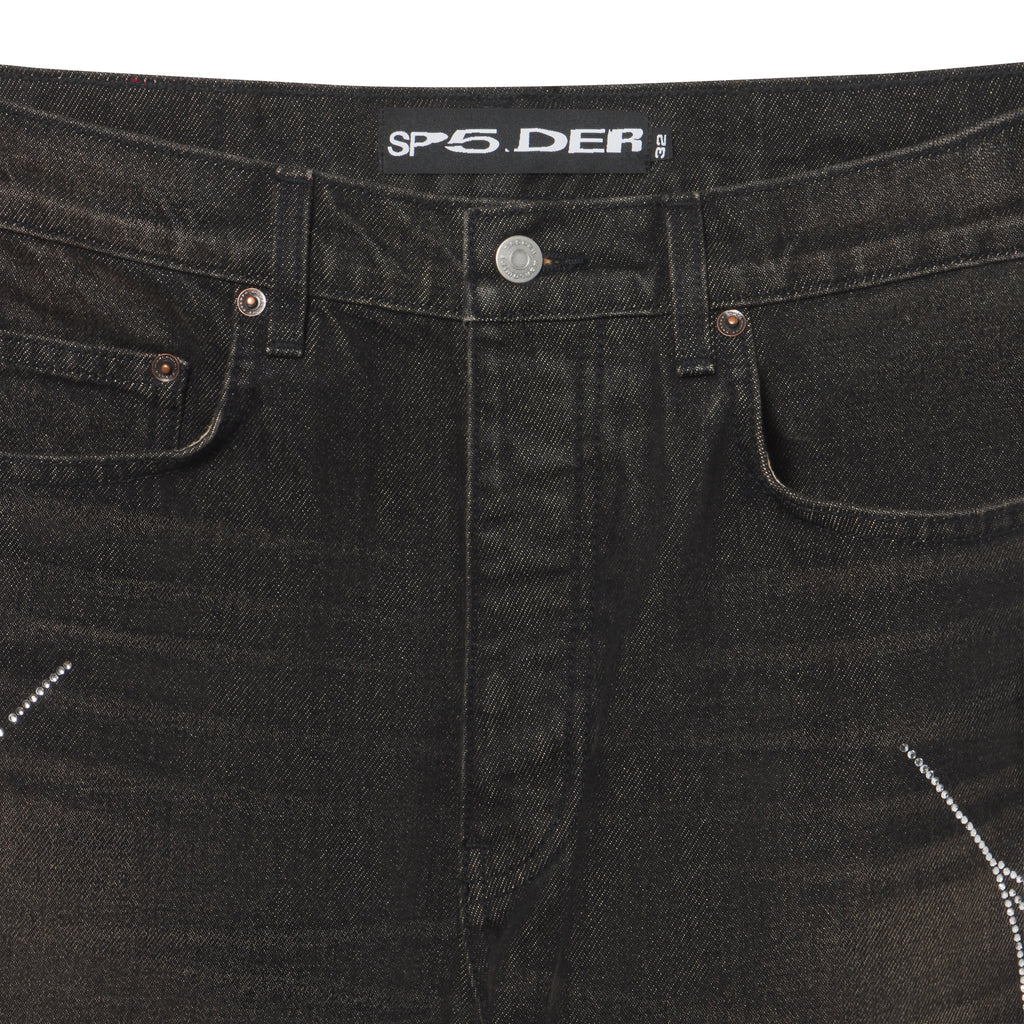 Faded black 13oz denim jeans featuring a rhinestone web graphic print and custom branded metal hardware.