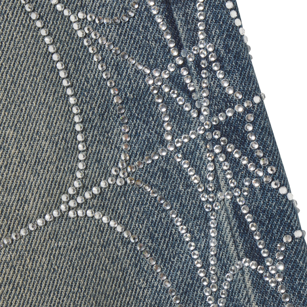 Faded blue 13oz denim jeans featuring a sparkling rhinestone web graphic print design.