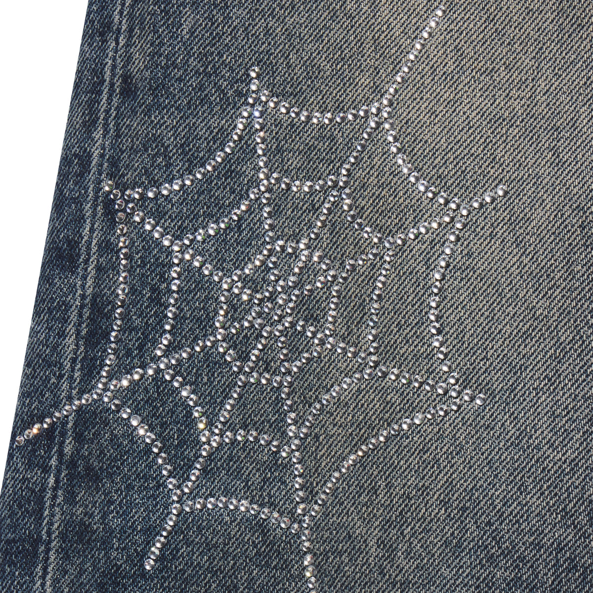 Faded blue 13oz denim jeans featuring a sparkling rhinestone web graphic print design.