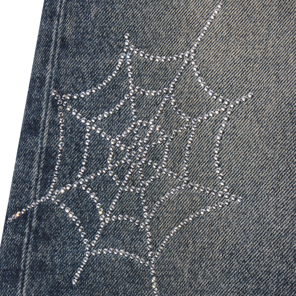 Faded blue 13oz denim jeans featuring a sparkling rhinestone web graphic print design.