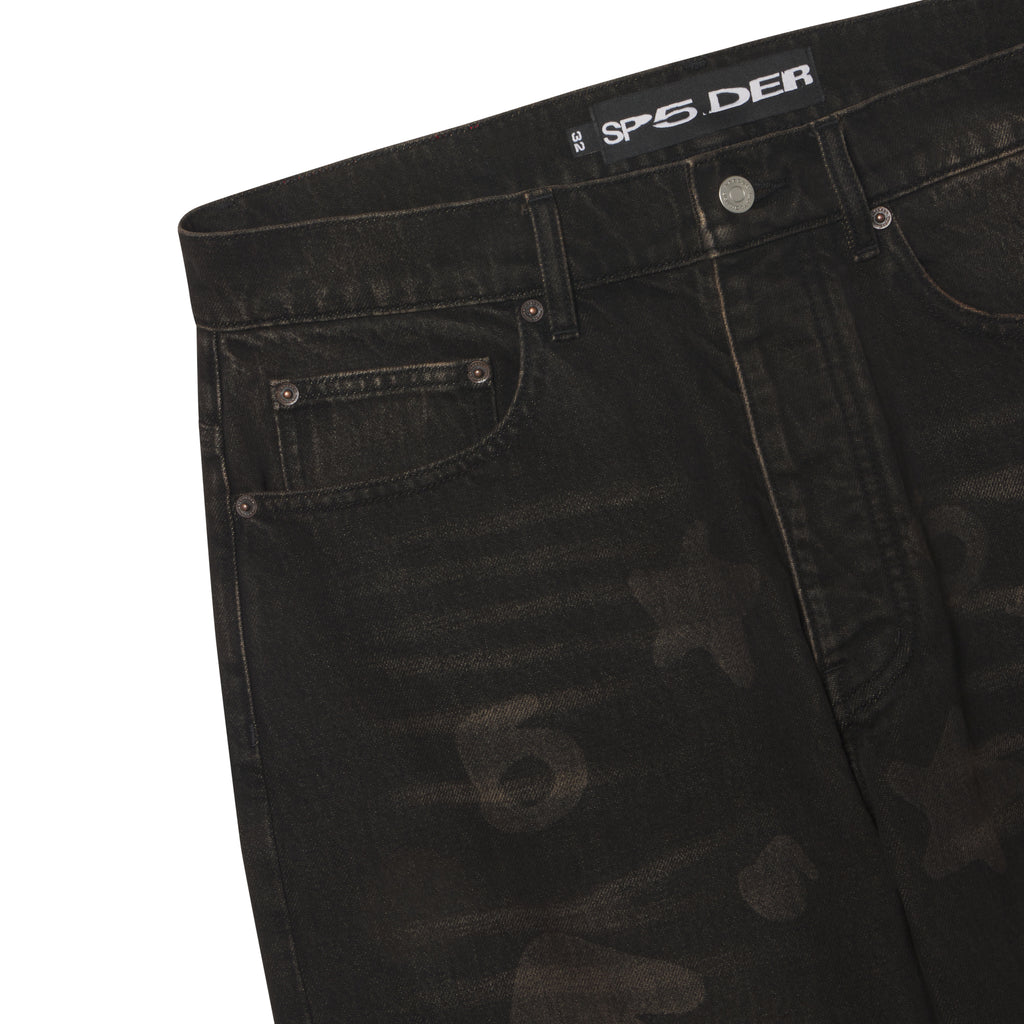 Black denim jeans with a faded Beluga graphic print, custom branded hardware, and a SP5DER logo patch at the waist.