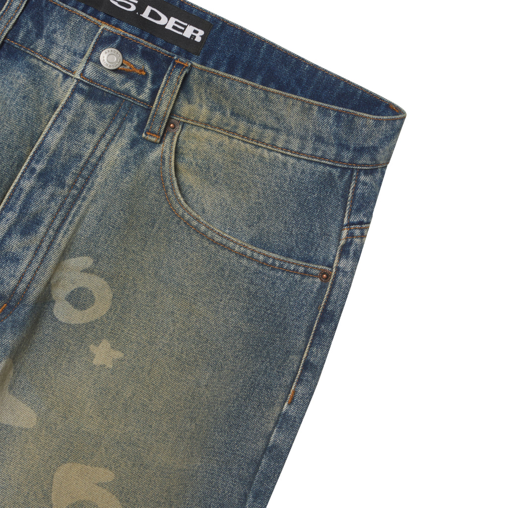Faded blue denim pants featuring a Beluga graphic print, custom branded hardware, and a classic five-pocket straight leg fit.