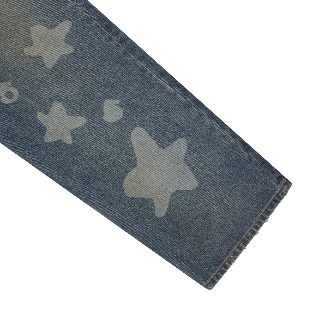 Blue denim jeans featuring a faded white star graphic print and a classic straight leg fit.