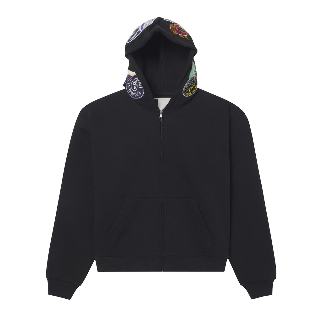 Black 13oz cotton fleece zip hoodie featuring a hood with mixed embroidered, woven, and chenille graphic patches.