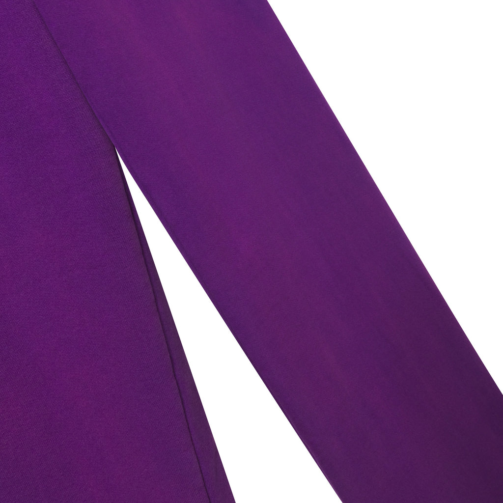 Close-up of purple 13oz cotton fleece fabric from the Studded OG Logo V2 sweatpants with a faded wash finish.