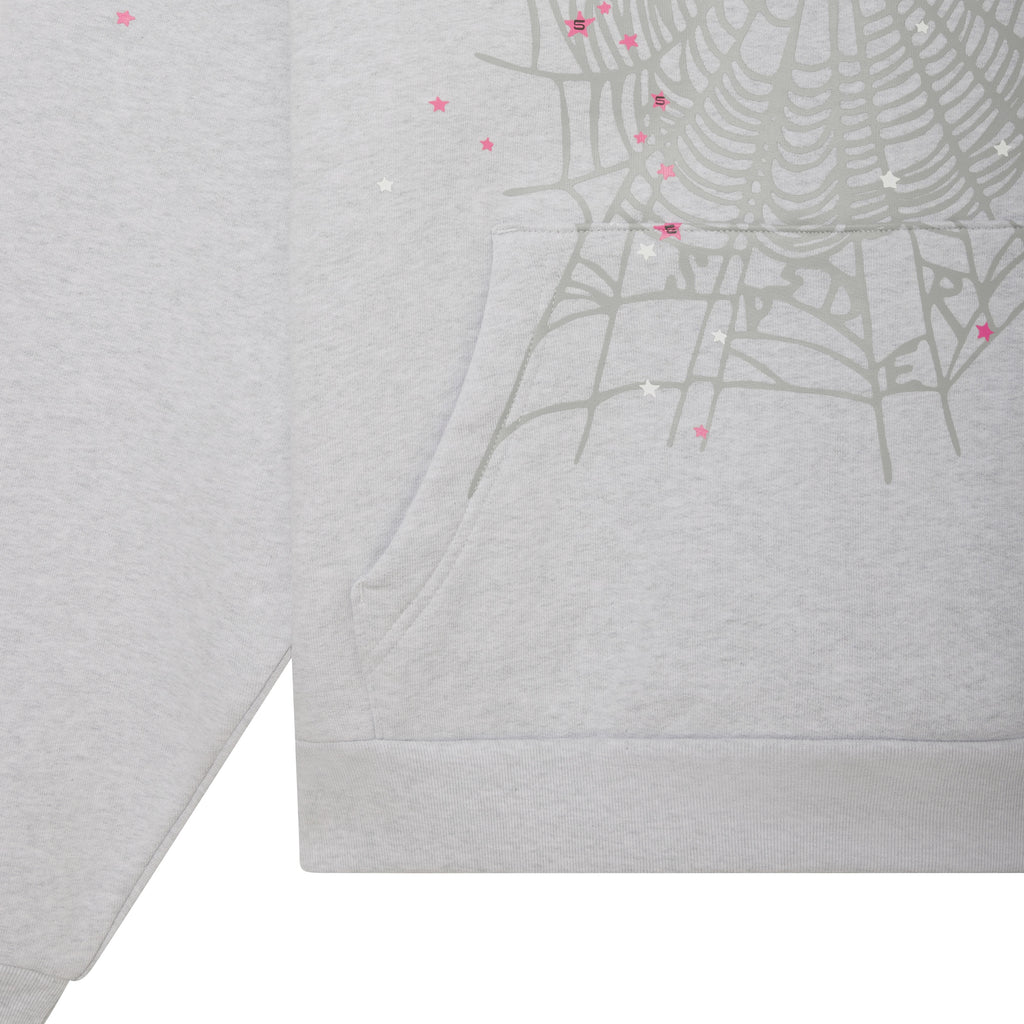 Light grey cotton fleece hoodie featuring a grey spiderweb graphic, pink star accents, and a front kangaroo pocket.