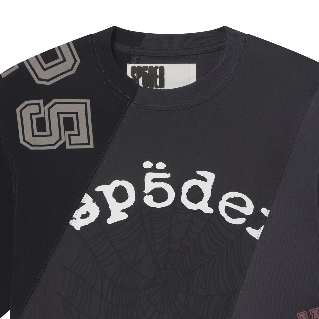 Black cotton crewneck tee with asymmetrical color-block panels, collegiate-style lettering, and web graphic print.