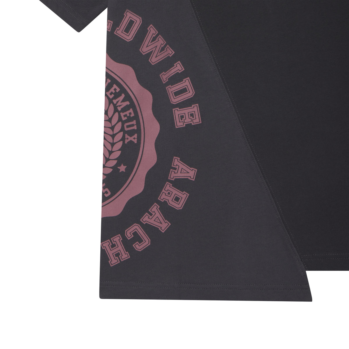 Black cotton tee with asymmetrical color-block panels and a collegiate-style graphic print.