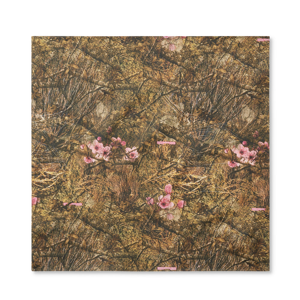 Square cotton gauze bandana with a real tree camo design and pink flowers.