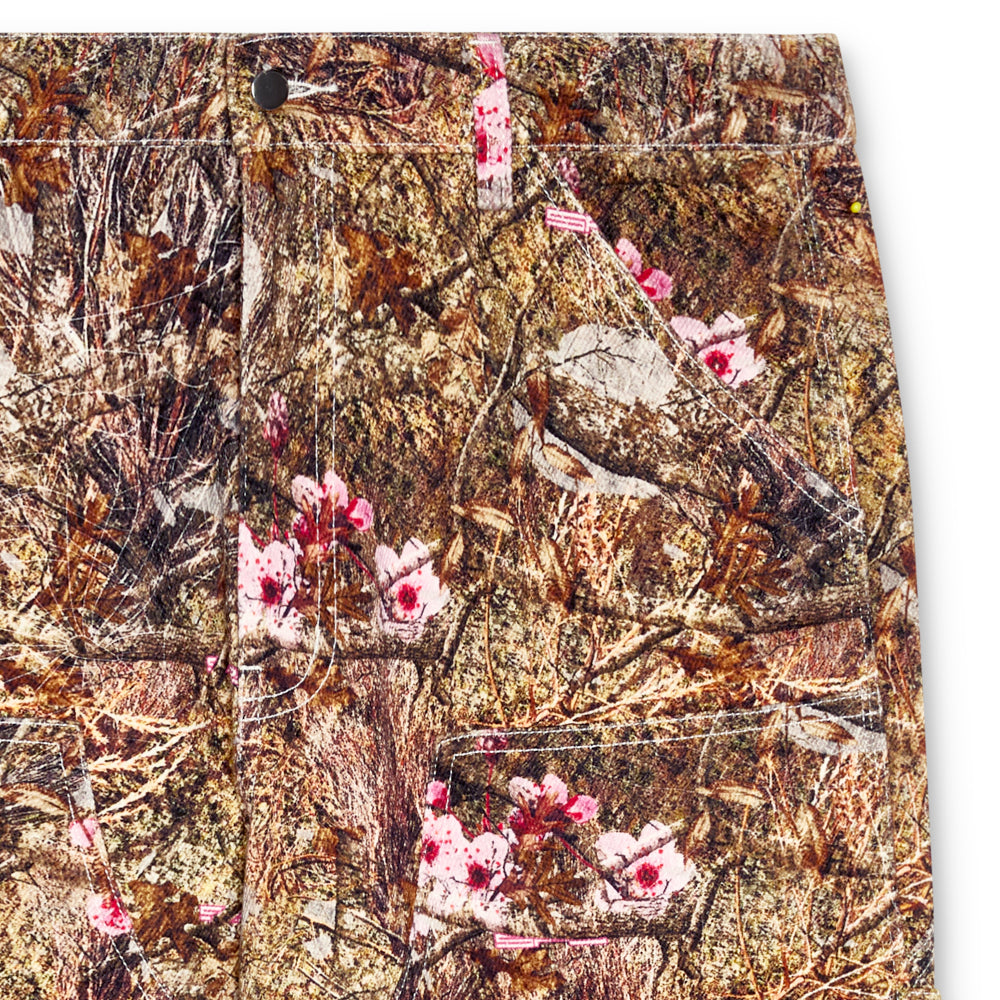Real Tree denim work pant with pink floral accents, straight-leg fit, and utility pockets.