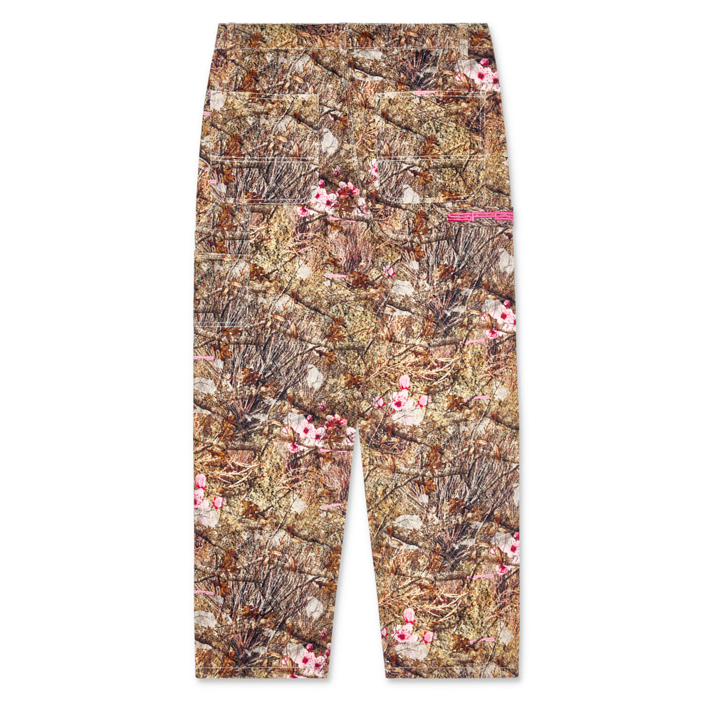 Real Tree print denim work pant with straight-leg fit, utility details, and pink floral accents.